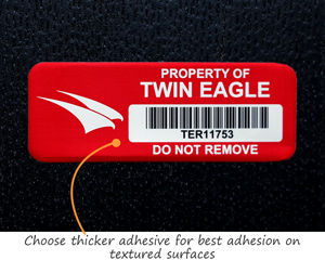 Asset tag with thick adhesive for textured surfaces